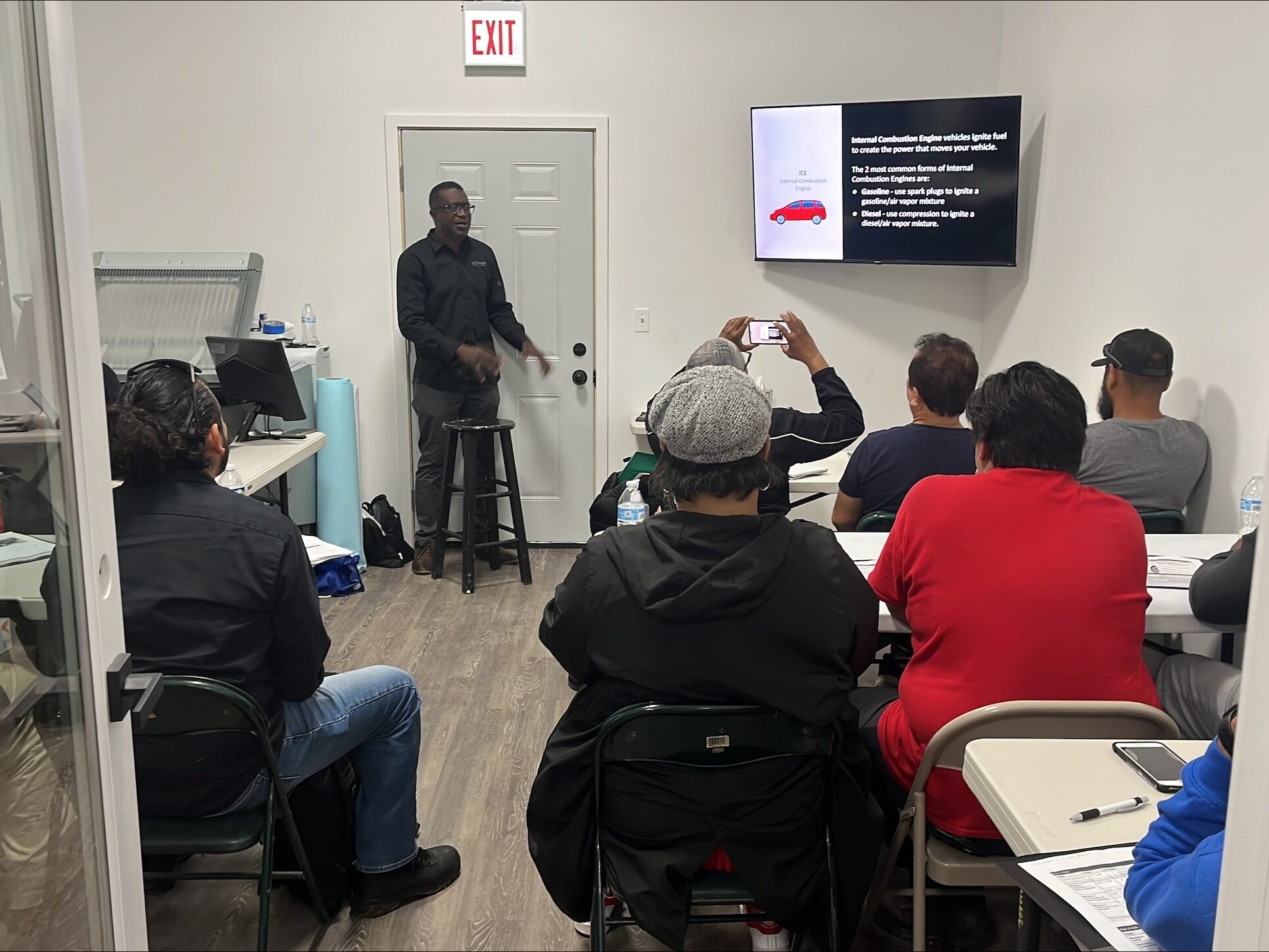 Angel Guillen, Co-Owner of InchargeE, beginning EV installation workshop lessons